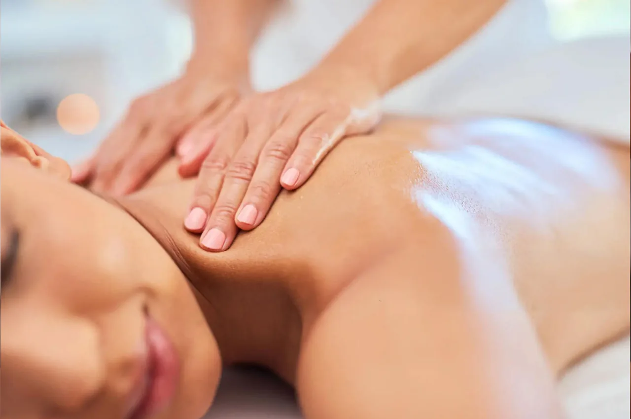 Shiatsu massage with thumb pressure along the back at G Spa Massage Cypress